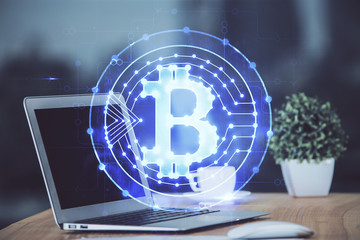 Multi exposure of blockchain theme hologram and table with computer background. Concept of bitcoin...