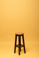 brown wooden chair isolated on yellow