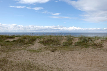 Empty sandy beach in Jurmala at the end of summer season photo in pastel colors