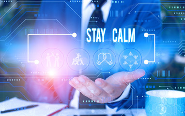 Text sign showing Stay Calm. Business photo showcasing Maintain in a state of motion smoothly even under pressure Male human wear formal work suit presenting presentation using smart device