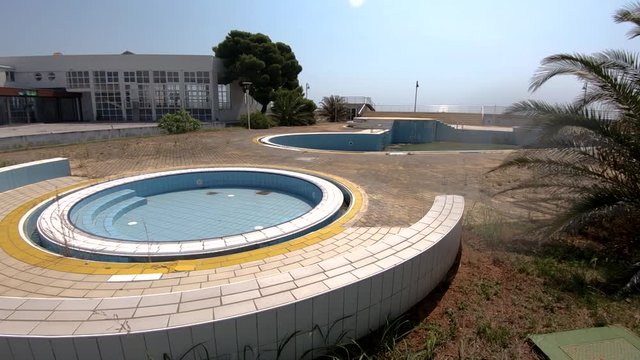 Parallax moving abandoned hotel with swimming pool