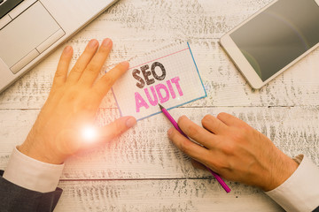 Writing note showing Seo Audit. Business concept for Search Engine Optimization validating and...