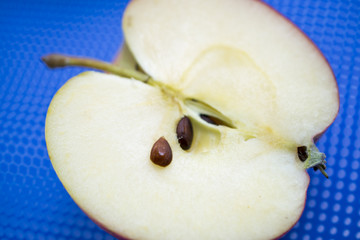 half ripe apple with pits