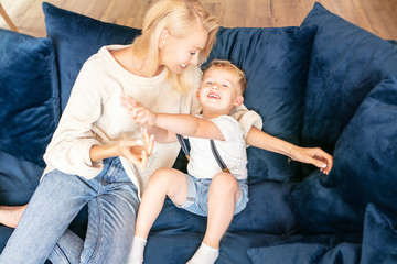 Mother with little boy having fun together.