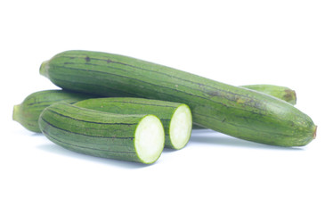 fresh green sponge gourd or luffa with slice isolated on white background