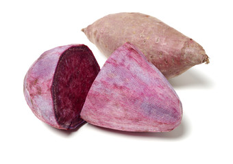 Purple Colored Sweet Potatoes on White background