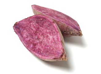 Obraz premium Purple Colored Sweet Potatoes on White background