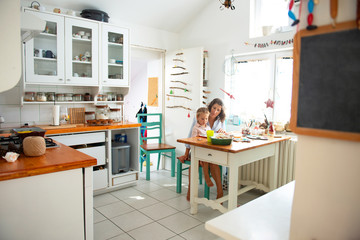 Mother learning her daughter to read	