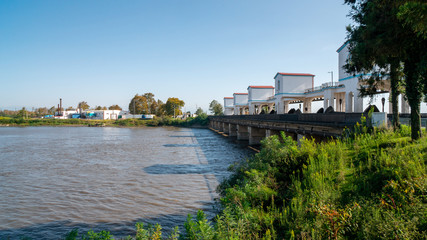 Obraz premium a unique bridge in the city of Poti on the Rioni River, the bridge delays the flow of water. Georgia.