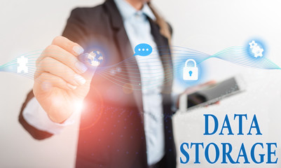 Handwriting text writing Data Storage. Conceptual photo the act of archiving data in electromagnetic or other forms Female human wear formal work suit presenting presentation use smart device