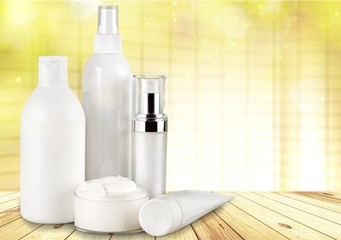 Cosmetic containers isolated on background