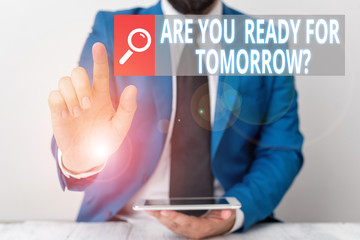 Writing note showing Are You Ready For Tomorrow Question. Business concept for Preparation to the future Motivation Businessman with pointing finger in front of him