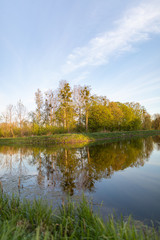 Fototapeta na wymiar Reflections on the lake. Landscape at a lake