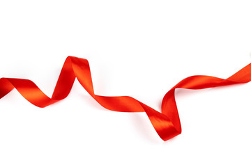 Red silk shiny ribbon isolated on white background.