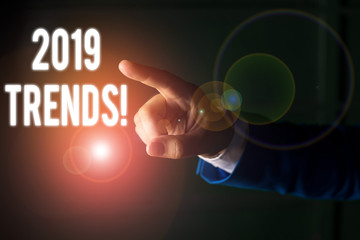 Word writing text 2019 Trends. Business photo showcasing general direction in which something is developing or changing Isolated hand pointing with finger. Business concept pointing finger