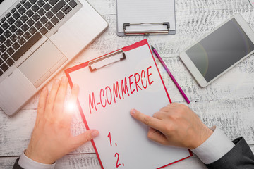 Word writing text M Commerce. Business photo showcasing commercial transactions conducted electronically by mobile phone