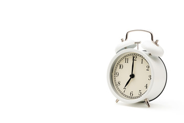 White Alarm clock in retro style isolated on white background with clipping path and copy space.