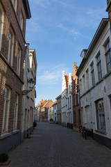 Fototapeta na wymiar Narrow street between houses old town Brugge, Belgium