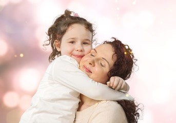 Happy Mother and daughter hugging, happy family, mothers day.