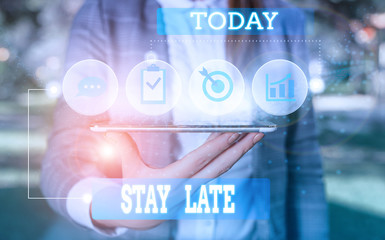 Text sign showing Stay Late. Business photo showcasing A routine in which a demonstrating goes to somewhere out of time Female human wear formal work suit presenting presentation use smart device