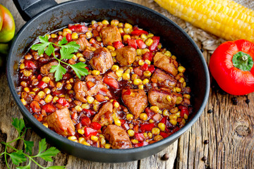 Meat stew with vegetables corn, pepper, onion, carrot in soy sauce gravy