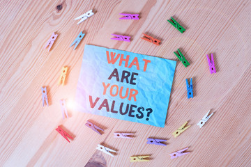 Word writing text What Are Your Values Question. Business photo showcasing asking someone about his good qualities Colored clothespin papers empty reminder wooden floor background office