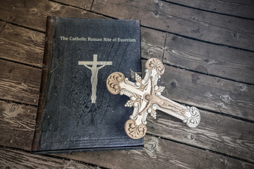 exorcism book on wooden floor