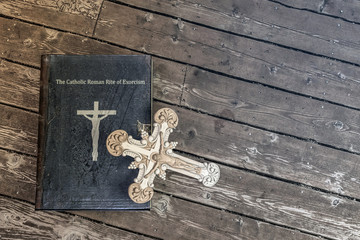 exorcism book on wooden floor