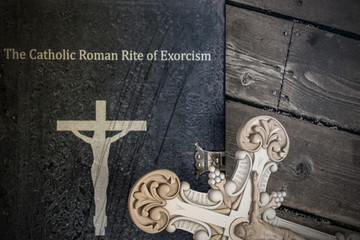 exorcism book on wooden floor