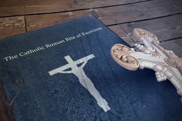 exorcism book on wooden floor