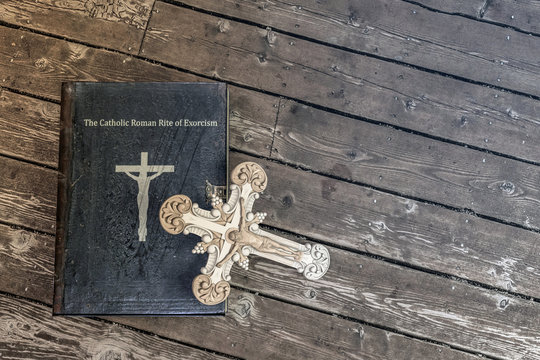 Exorcism Book On Wooden Floor