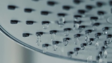 Close-up shot water drop from rain shower with dark and grain processed