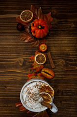 Top vertical view of autumnal decor and warm cup of coffee