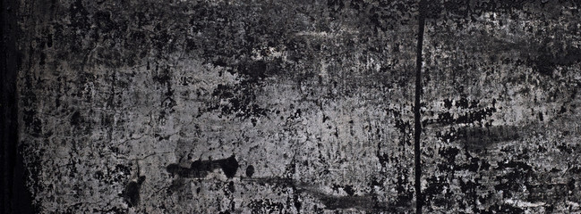 old black paint texture peeling off the concrete wall for dark theme banner background