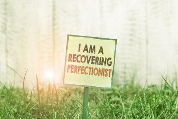 Conceptual hand writing showing I Am A Recovering Perfectionist. Concept meaning Obsessive...