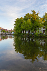 Fototapeta na wymiar Colored romantic houses by the canal in the historic city center of Brugge