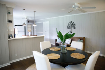 Small eat-in kitchen dining room with a small table for four and upholstered chairs