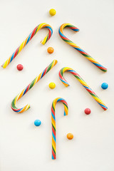 candy cane, peppermint stick, cinnamon stick shaped like a Сhristmas tree. Christmas decorations, winter Holidays, New Year concept.