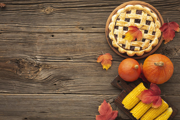 Flat lay frame with tasty pie and corn