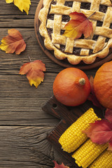 Flat lay arrangement with tasty pie and corn