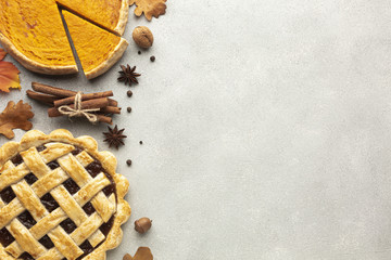 Flat lay frame with sliced pumpkin pie and acorn