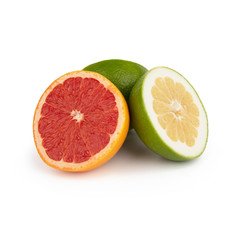 Fototapeta na wymiar A group of green and orange grapefruit / pomelo is cut into pieces with juicy yellow and red pulp Isolated on a white background. Side view.