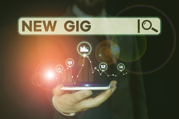 Conceptual hand writing showing New Gig. Concept meaning getting job Attending live Concert Gigabyte Freelancer offer Male wear formal suit presenting presentation smart device