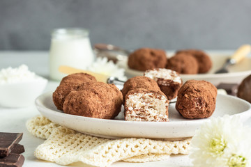 Curd cheese or cottage cheese bars with cocoa powder on a plate. Protein bar. Dessert with cottage cheese covered cocoa.