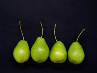 Pears on a black background. vitamins.