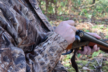 Hunter Loads a double-barreled shotgun with ammunition on the hunt.