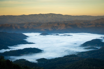 Fototapeta na wymiar Mist landscape with mountain and sunrise