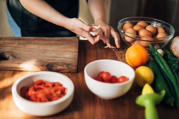 Female chef preparing a dish in the kitchen