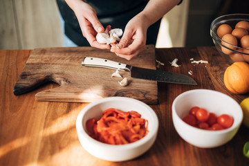Female chef preparing a dish in the kitchen