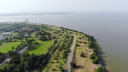 Drone shot aerial view scenic landscape of the road at the country side with a big river